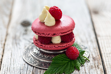 Image showing Macaroon with ripe raspberries.