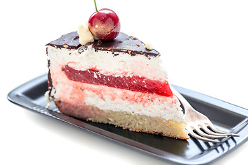 Image showing Piece of chocolate cake with cherry and vanilla.