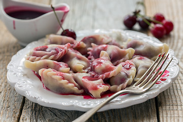 Image showing Sweet dumplings with cherry.