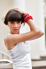 Image showing Attractive sad girl with red beads