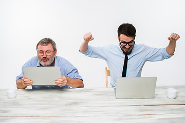 Image showing The two colleagues working together at office on white background