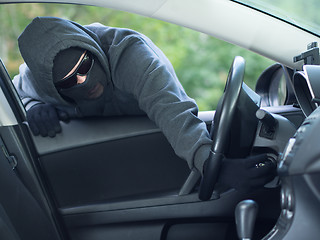 Image showing Burglar wearing mask balaclava, car burglary