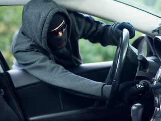 Image showing Burglar wearing mask balaclava, car burglary