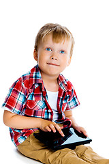 Image showing Little boy with a tablet computer
