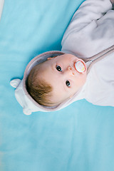 Image showing Baby on a blue blanket