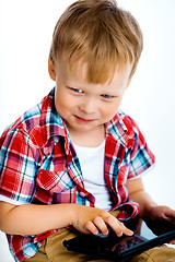 Image showing smiling boy with a tablet computer