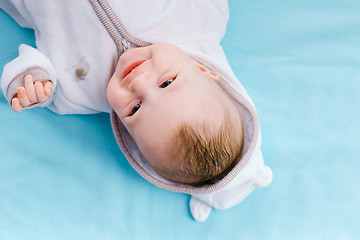 Image showing Baby on a blue blanket