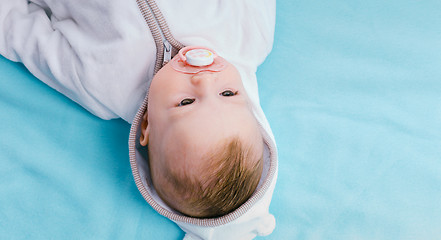 Image showing Baby on a blue blanket