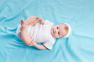 Image showing Baby on a blue blanket