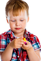 Image showing Little boy with a toy