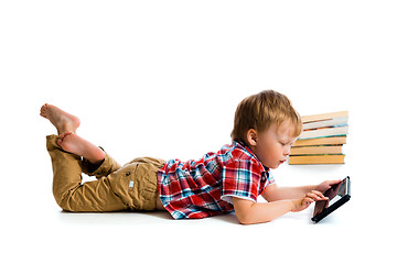 Image showing small boy with tablet computer and books