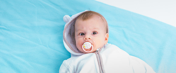 Image showing Baby on a blue blanket