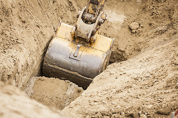 Image showing Excavator Tractor Digging A Trench