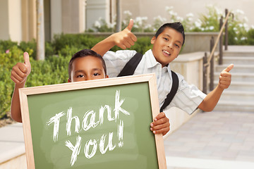 Image showing Boys Giving Thumbs Up Holding Thank You Chalk Board