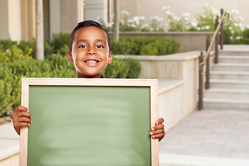 Image showing Hispanic Boy Holding Blank Chalk Board on School Campus