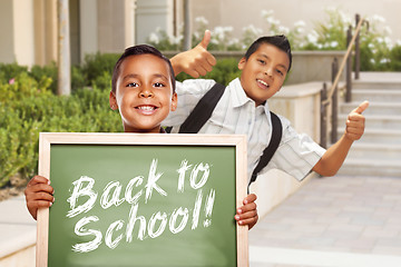 Image showing Boys Giving Thumbs Up Holding Back to School Chalk Board