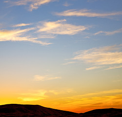 Image showing the sunrise in  colored sky white soft clouds and abstract backg