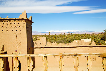 Image showing brown old  construction in  africa   tower snow palm tree