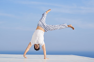 Image showing young man practicing yoga