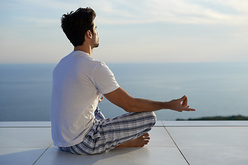 Image showing young man practicing yoga