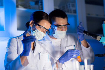 Image showing close up of scientists making test in lab