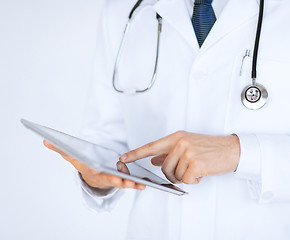 Image showing male doctor holding tablet pc