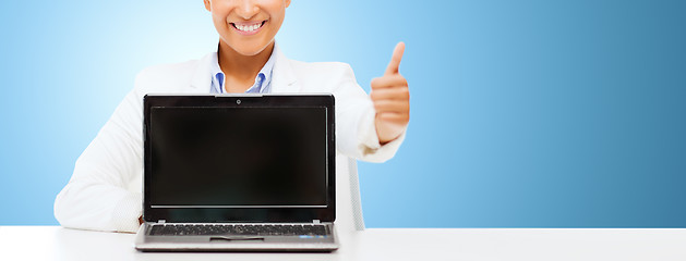 Image showing smiling woman with laptop computer