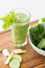 Image showing close up of fresh green juice glass and celery