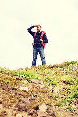 Image showing tourist with beard and backpack looking far away