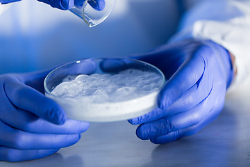 Image showing close up of scientists hands with chemicals in lab