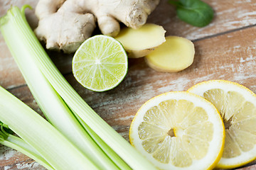 Image showing close up of ginger, celery and lemon on table