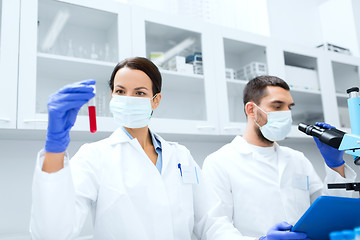 Image showing young scientists making test or research in lab