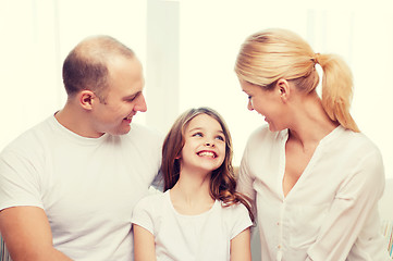 Image showing smiling parents and little girl at home