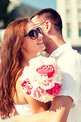 Image showing smiling couple in city