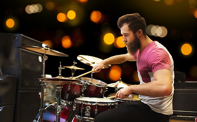 Image showing male musician playing cymbals at music concert