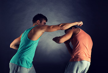 Image showing young men wrestling