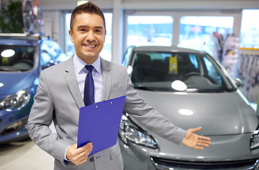 Image showing happy man at auto show or car salon