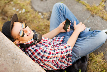 Image showing girl with headphones and smartphone