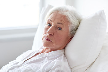 Image showing senior woman patient lying in bed at hospital ward