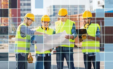 Image showing builders in hardhats and vests with blueprint