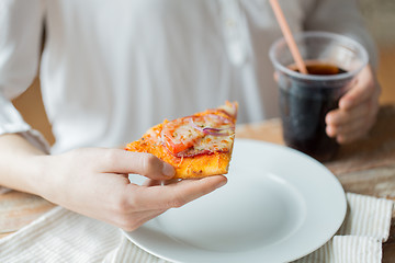 Image showing close up of woman with pizza and coca cola drink