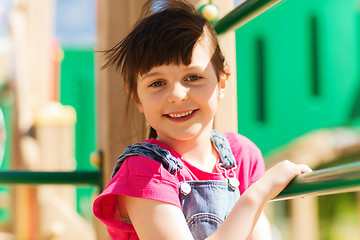 Image showing happy little girl climbing on children playground