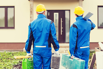 Image showing group of builders with toolboxes