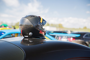 Image showing close up of car with helmet on roof top