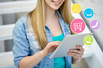 Image showing close up of female hands with tablet pc on stairs