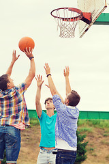 Image showing group of teenagers playing basketball