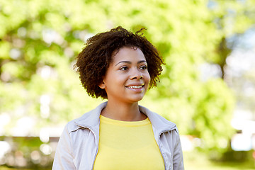 Image showing happy african american young woman in summer park