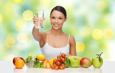 Image showing happy woman with healthy food showing water glass