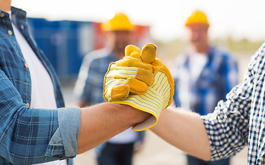 Image showing close up of builders hands making handshake