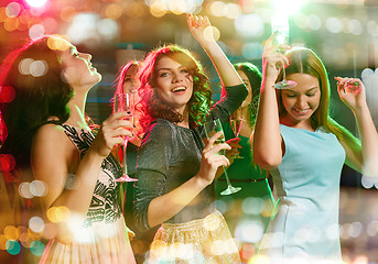 Image showing smiling friends with glasses of champagne in club